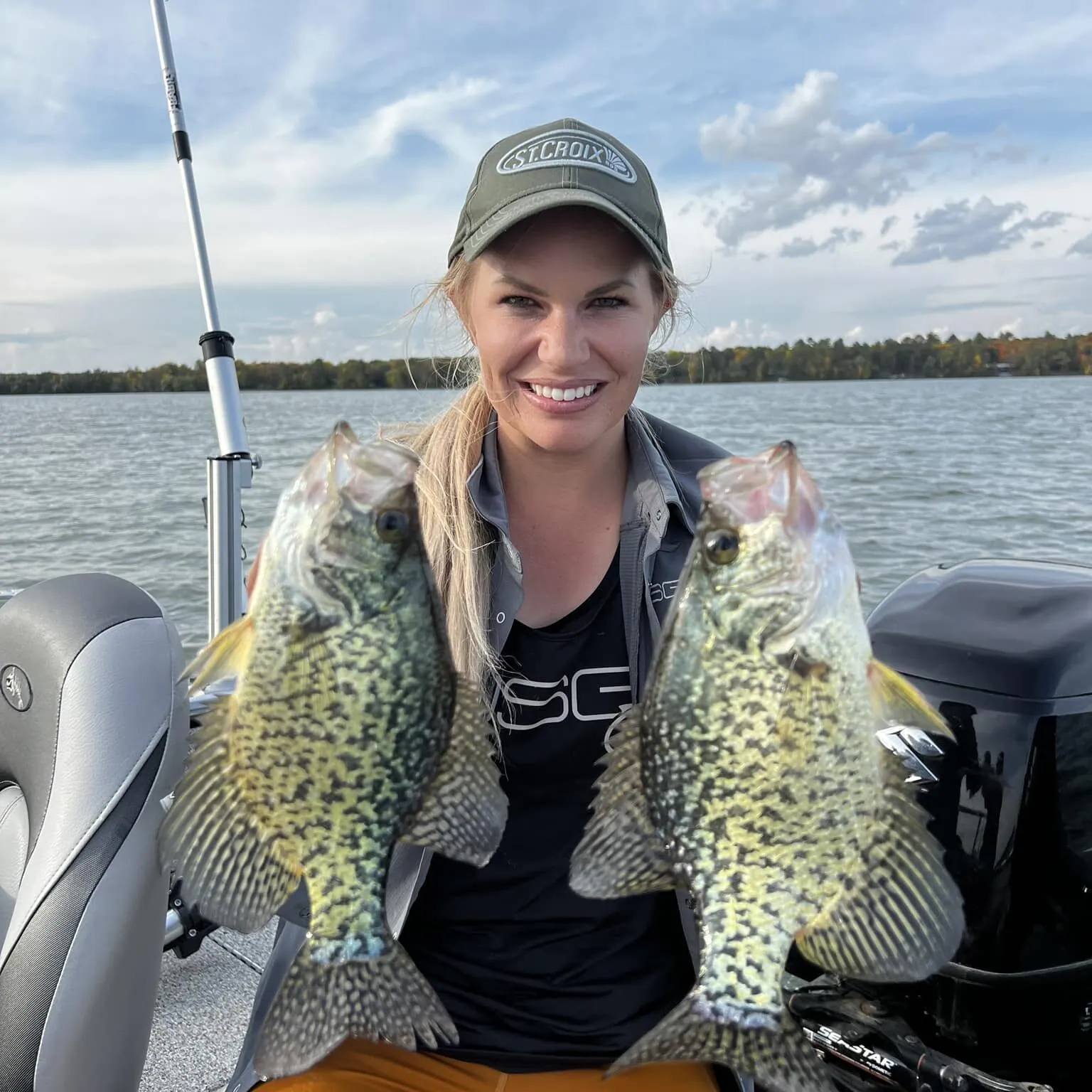 Nicole Stone holding two crappie caught on Bobby Garland plastics